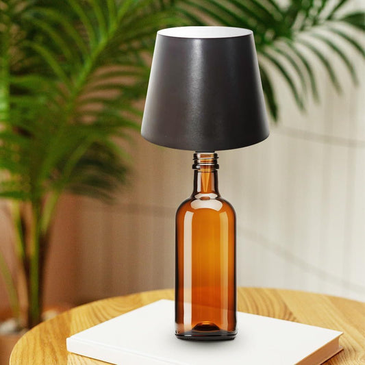 USB rechargeable LED wine bottle lamp glowing on table